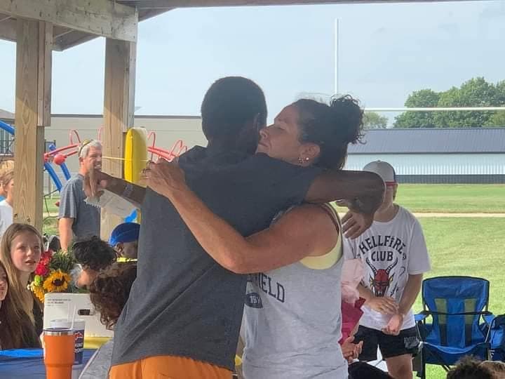 Christian and Sam embrace