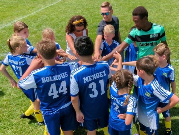 Christian leads hands in